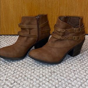 Brown zip up booties with buckle details